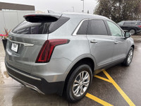 The 2023 Cadillac XT5, finished in a sleek Argent Silver Metallic paint, offers a confident all-whee... (image 7)