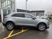 The 2023 Cadillac XT5, finished in a sleek Argent Silver Metallic paint, offers a confident all-whee... (image 8)