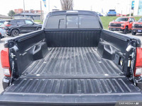 From work to weekends, this previous daily rental Black 2023 Toyota Tacoma muscles through any terra... (image 6)