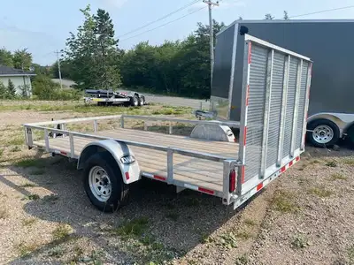 Financing available 6 ½ x 12 Galvanized 14" Tires and Galv Rims Full Mesh Ramp Pressure treated deck...