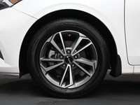 Experience refined performance and modern comfort with the 2024 Kia Forte 5 EXâ€”a sleek, sporty hat... (image 3)