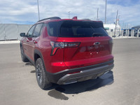 The 2025 Chevrolet Equinox ACTIV, dressed in a bold Radiant Red exterior with a distinctive Maple Su... (image 5)