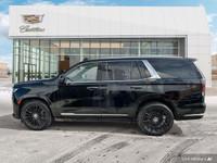 The 2022 Cadillac Escalade highlights include adaptive cruise control, panoramic roof, 3rd-row seati... (image 1)