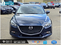 Just Arrived 2018 Mazda MAZDA3 i Touring AT 5-Door Blue has 102,283 KM on it. 2L 4 Cylinder Engine e... (image 1)
