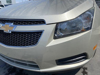 The 2014 Chevrolet Cruze 1LS offers a practical and efficient driving experience in a compact sedan.... (image 2)