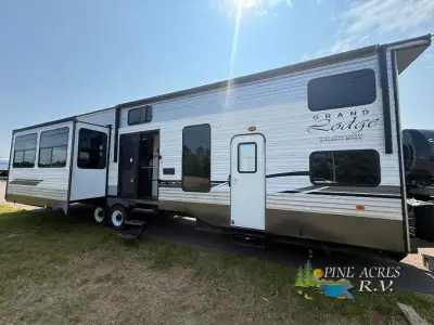 Forest River Wildwood Grand Lodge destination trailer highlights: Kitchen Island Loft Private Front...