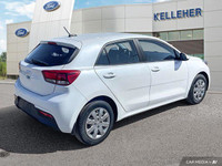 This 2022 Kia Rio 5-door LX+ hatchback offers practical everyday driving with surprising comfort. Wi... (image 4)