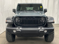 The 2025 Jeep Wrangler 4-Door Willys in stunning gray with 44 drive is a vehicle designed to conquer... (image 1)
