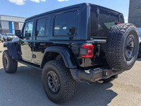 This Jeep Wrangler boasts a Premium Unleaded V-8 6.4 L/392 engine powering this Automatic transmissi... (image 1)