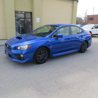 Check out this stylish 2015 Subaru WRX Premium sedan with a sleek blue exterior and a comfortable bl... (image 2)
