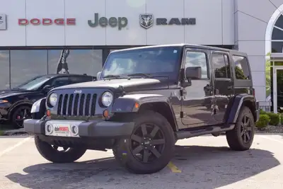Experience legendary capability with the 2013 Jeep Wrangler 4WD 4dr Sahara, available now at Dale Wu...