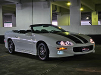 Unleash raw American muscle this summer with this stunning 2002 Chevrolet Camaro Z28 Convertible. Po... (image 1)