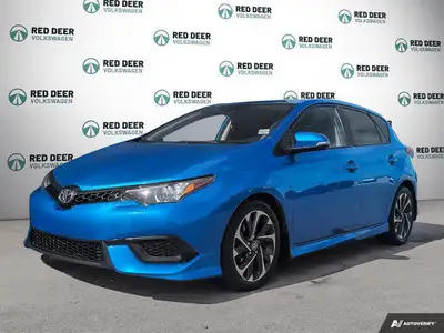 Experience the vibrant blue 2018 Toyota Corolla iM, a front-wheel-drive sedan designed for precision...