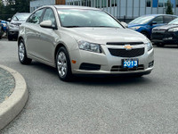 This 2013 Chevrolet Cruze has a Grey exterior and Grey seats with seating for 5. Equipped with a 1.4... (image 9)