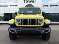 Turn heads and conquer any terrain in this vibrant 2024 Jeep Wrangler Sahara, boasting a striking Hi... (image 9)