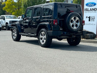 This 2018 Jeep Wrangler Sahara has a Black Exterior and Black Interior with seating for 5. Equipped... (image 3)
