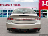 Experience effortless elegance with this 2016 Lincoln MKZ. Boasting a sleek silver exterior and a me... (image 4)