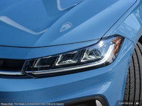 The 2025 Volkswagen Jetta Comfortline is a stunning blue sedan that offers a smooth driving experien... (image 9)