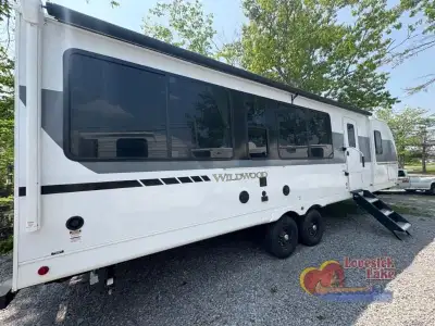 Forest River Wildwood View travel trailer T28VIEWX highlights: Island with Four Bar Stools Hidden Pa...