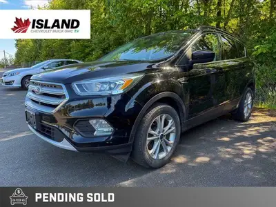 This 2018 Ford Escape SEL, boasting a sleek black exterior, is ready for your next adventure. With i...