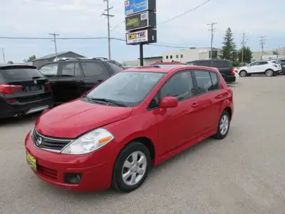 All our listed prices are cash price plus tax. 2010 Nissan Versa SL comes with Cloth Interior, Tract...
