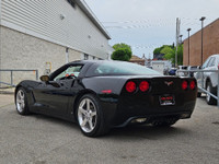This isn’t just a car—it’s a statement. Draped in sleek black-on-black with polished chrome wheels t... (image 5)