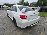 2014 Subaru WRX STI with the 6-speed manual and only 116,000kms! Vehicle comes safety certified! Two... (image 6)