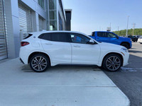 Unveil the allure of the 2022 BMW X2 xDrive28i, a summit of automotive craftsmanship adorned in a st... (image 9)