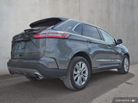 This 2024 Ford Edge Titanium AWD, presented in a sophisticated *Gray* finish, offers a compelling bl... (image 6)