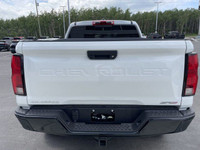 The 2025 Chevrolet Colorado ZR2, presented in Summit White with a Jet Black/Artemis interior, is eng... (image 7)