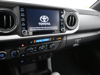 Introducing the sleek blue 2023 Toyota Tacoma. This truck is packed with various features to make yo... (image 7)