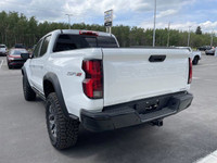 The 2025 Chevrolet Colorado ZR2, presented in Summit White with a Jet Black/Artemis interior, is eng... (image 5)