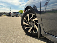 This 2019 Honda Civic Sedan EX boasts a stunning Cosmic Blue Metallic exterior and a sleek black fab... (image 9)