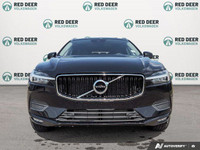 The 2021 Volvo XC60 T5 AWD Momentum is a sophisticated black SUV that offers an impeccable balance o... (image 2)
