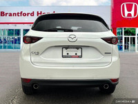 Experience the smooth handling and confident all-wheel drive of this 2021 Mazda CX-5 CX5TRXA. With o... (image 4)