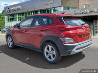 This 2022 Hyundai Kona Preferred SUV boasts a vibrant Pulse Red exterior and a sleek black interior.... (image 2)