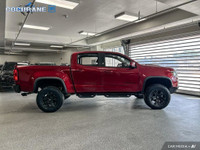 Get behind the wheel in our used 2021 Chevrolet Colorado ZR2 Crew Cab short box 4X4 in Cherry Red Ti... (image 5)