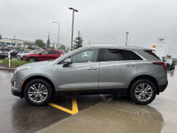 The 2023 Cadillac XT5, finished in a sleek Argent Silver Metallic paint, offers a confident all-whee... (image 4)