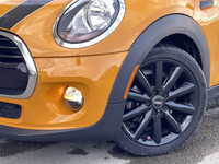 This 2018 Mini Cooper 5 door finished in volcanic orange is not only unique but filled with all the... (image 1)