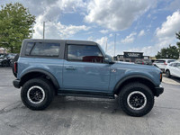This 2023 Ford Bronco Outer Banks is a head-turner, boasting a Velocity Blue Metallic exterior and a... (image 3)