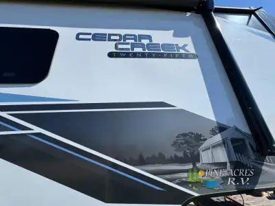Forest River Cedar Creek fifth wheel 388RK2 highlights: Bath and a Half Rear Kitchen Fireplace Maste...