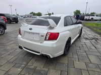 2014 Subaru WRX STI with the 6-speed manual and only 116,000kms! Vehicle comes safety certified! Two... (image 4)