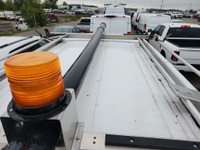 This is a low roof, T-150 All Wheel Drive unit with shelving and roof rack. Fully loaded, back up ca... (image 4)