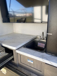 East to West Alta with bunkroom! This trailer features 2 slides, one in the main living area and ano... (image 1)
