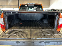 Take on your day in style with our 2019 Nissan Titan PRO-4X Crew Cab 4X4 shown off in Habanero Orang... (image 8)