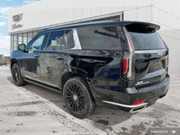 The 2022 Cadillac Escalade highlights include adaptive cruise control, panoramic roof, 3rd-row seati... (image 2)