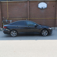This 2019 Volkswagen Jetta is a stylish sedan with a sleek black exterior and dual tone black and pe... (image 4)