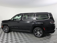 Driving our luxurious 2022 Jeep Grand Wagoneer Series I 4X4 in Diamond Black Crystal Pearl is a grea... (image 8)