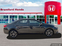 This 2017 Toyota Corolla SE boasts a sleek Slate Metallic exterior and a comfortable BLACK SOFTEX LE... (image 6)