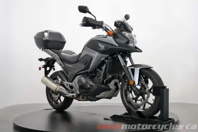 The NC750 is a great all around touring/adventure bike with good neutral ergonomics and a unique bui...